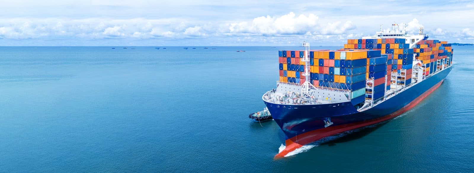 A container ship under way at sea, seen from the air